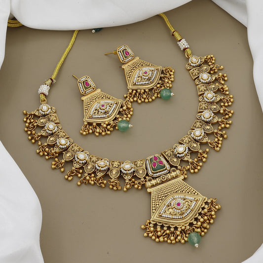 Antique Gold Toned Necklace Set with Ruby, Kundan, and Green Stone