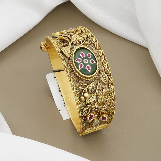 Ornate Floral Bangle Kada with Green Stone & Ruby Accents