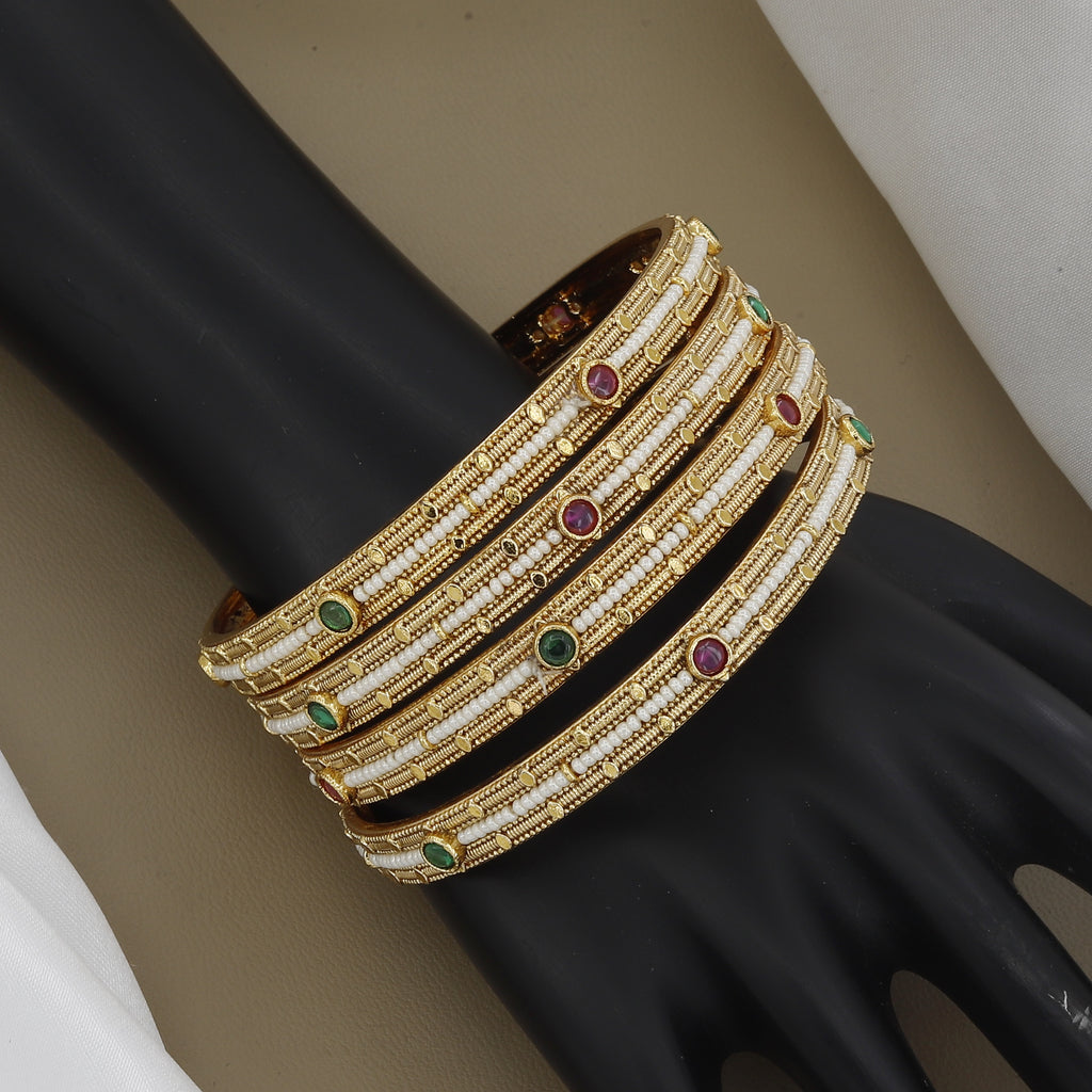 Elegant Pearl Beaded Gold Toned Bangle Set with Kundan Stones