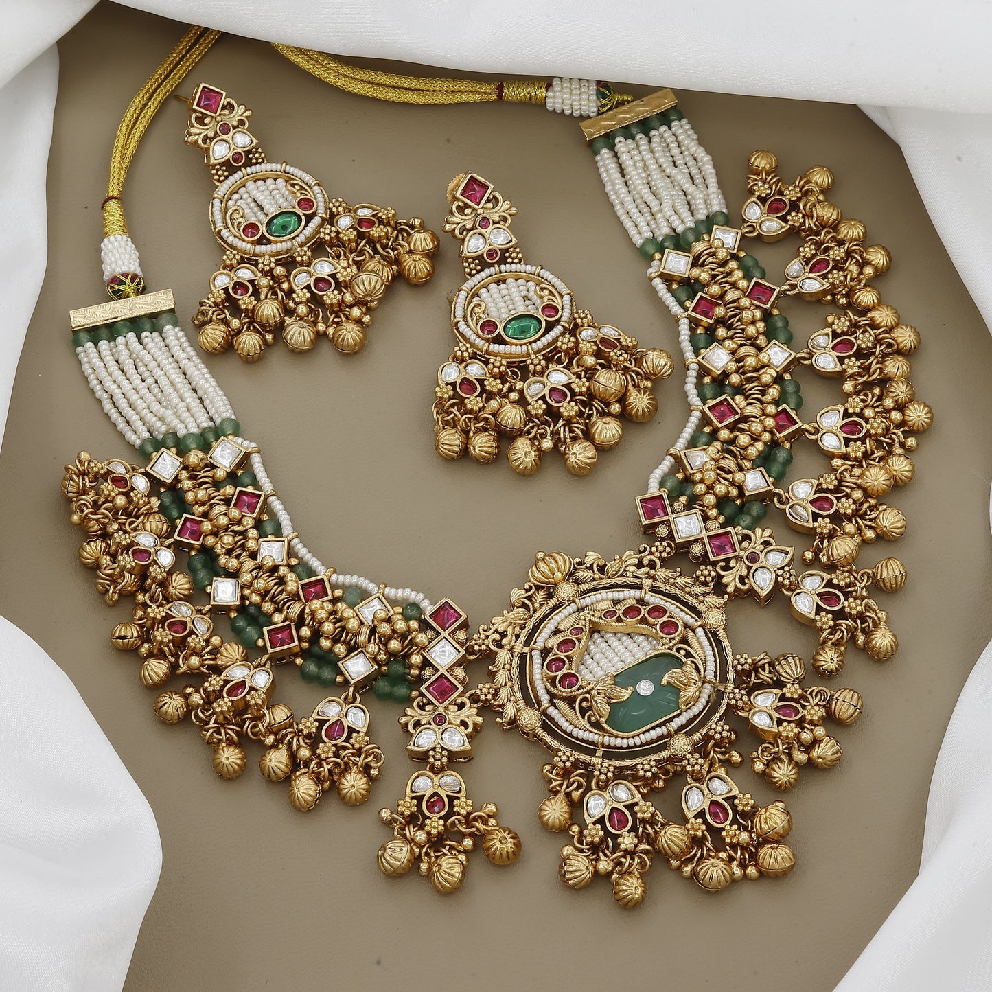 Regal Kundan & Ruby Necklace Set with Intricate Green Stone Detail