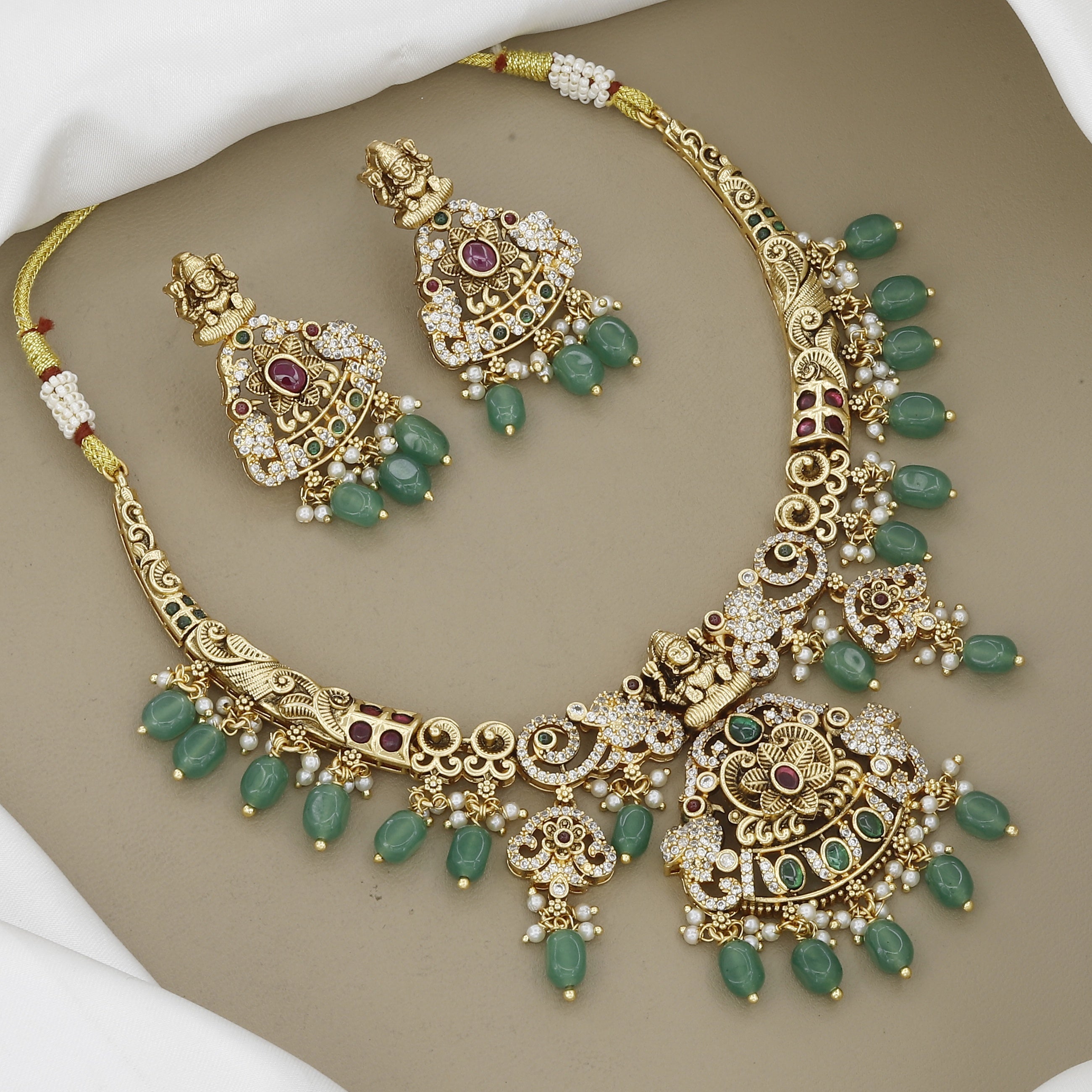 Antique Gold Finish Temple Jewellery Set with Green Beads & Goddess Lakshmi Motifs