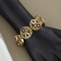Antique Gold Circular Link Bracelet with Intricate Filigree and Ruby Accents