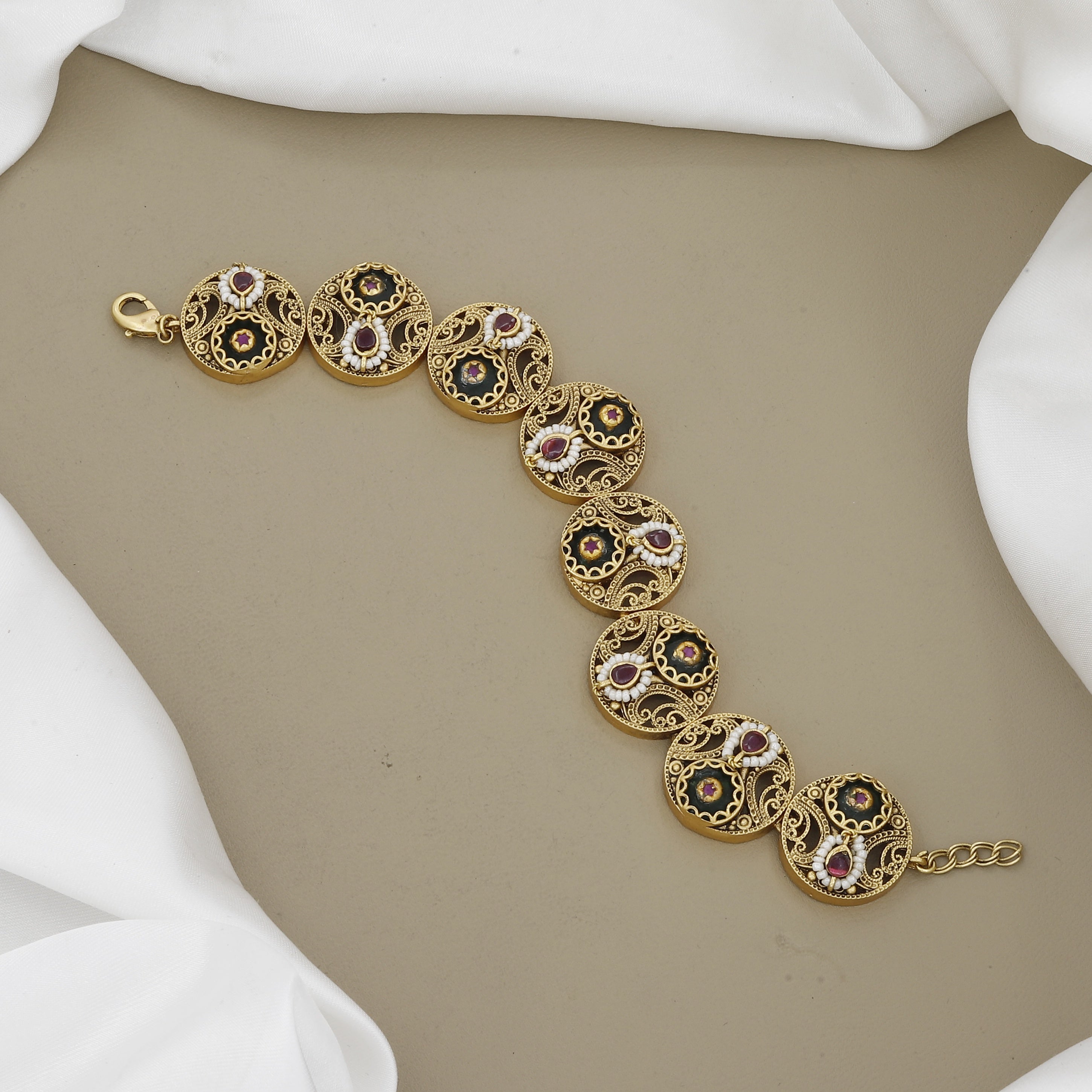 Antique Gold Circular Link Bracelet with Intricate Filigree and Ruby Accents