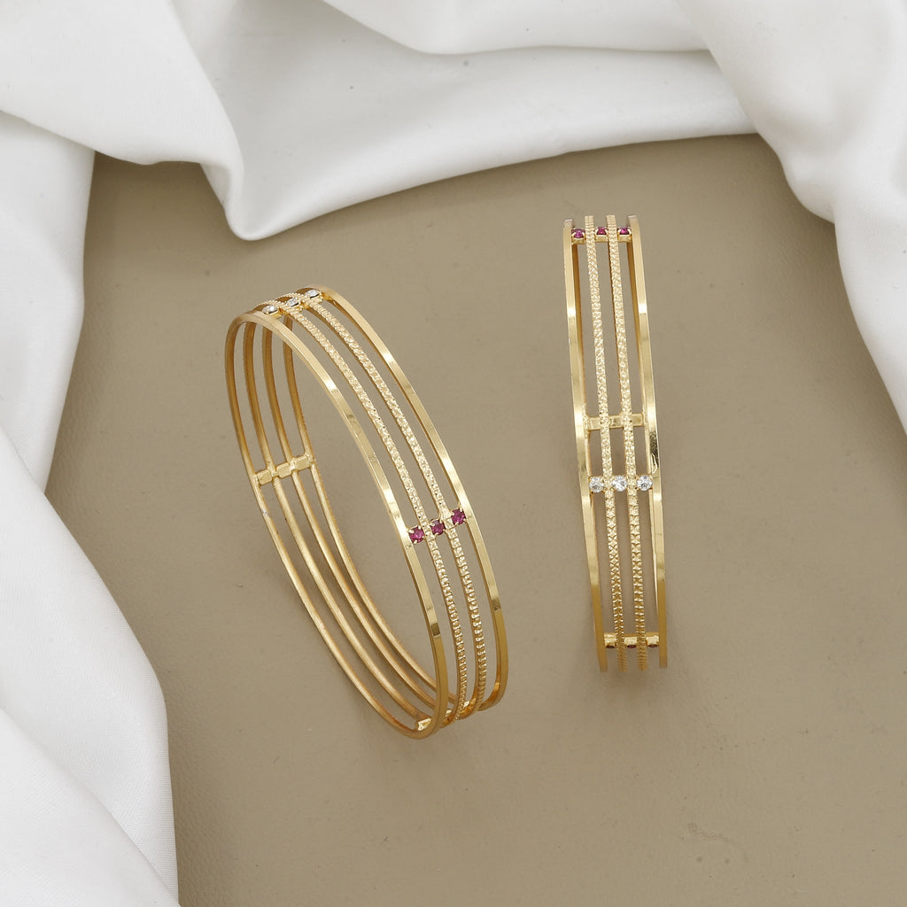 Minimalist Four-Line Gold Toned Bangle Set with Red Stones