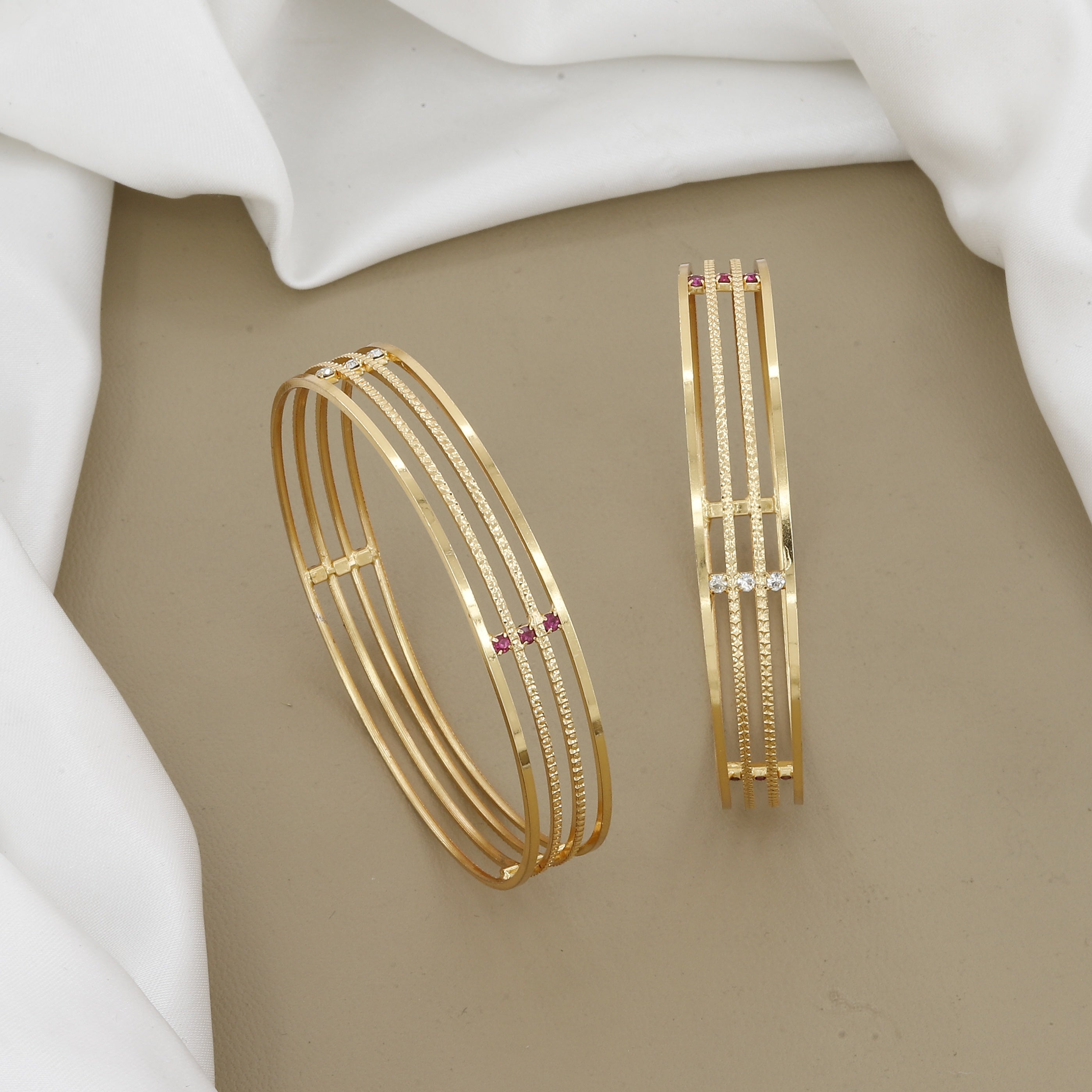 Minimalist Four-Line Gold Toned Bangle Set with Red Stones