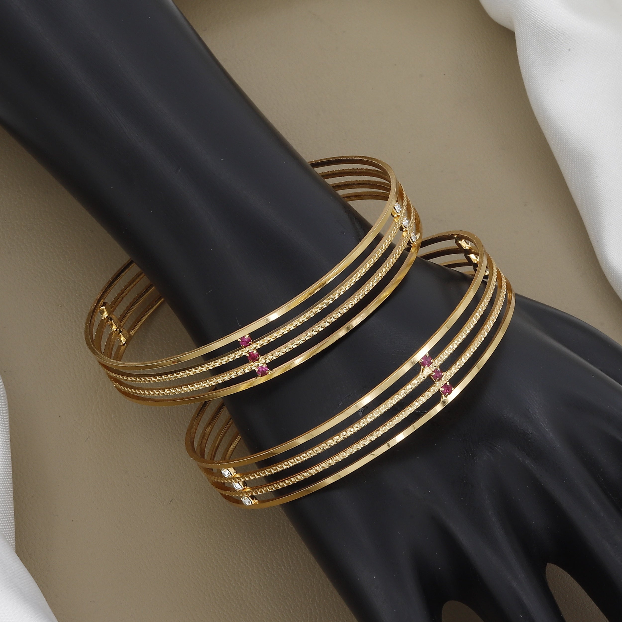 Minimalist Four-Line Gold Toned Bangle Set with Red Stones