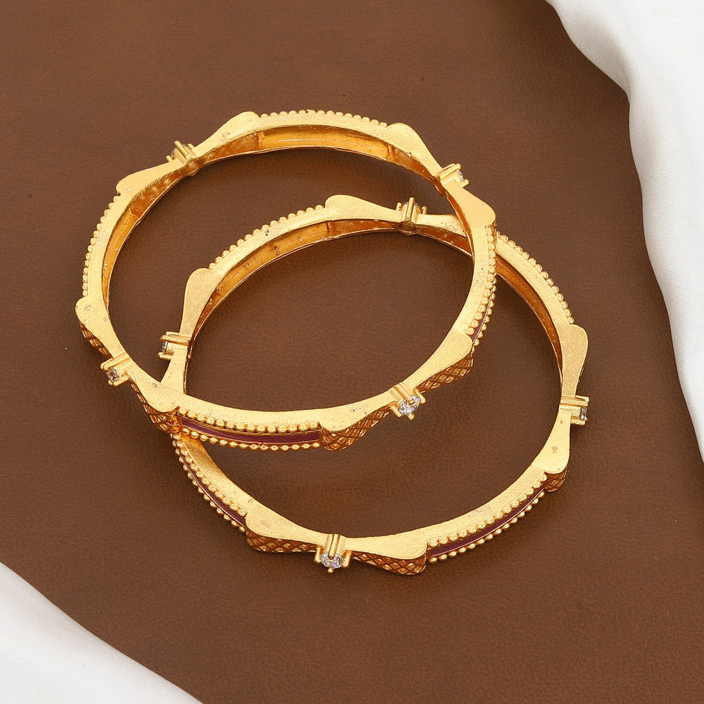 Traditional Gold Jaali Work Bangles with Pink Accents