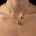 Gold Orb & Knot Pendant Necklace