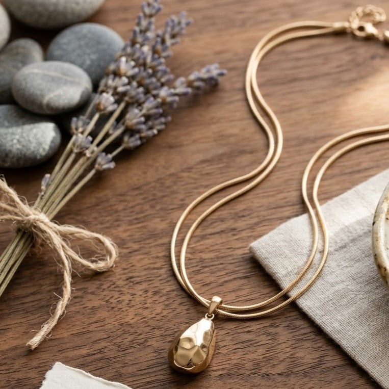 Gold Faceted Teardrop Pendant on Triple-Strand Chain