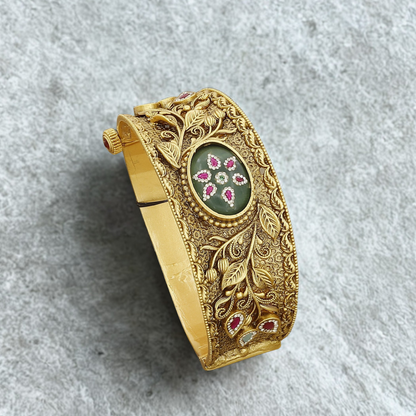 Ornate Floral Bangle Kada with Green Stone & Ruby Accents