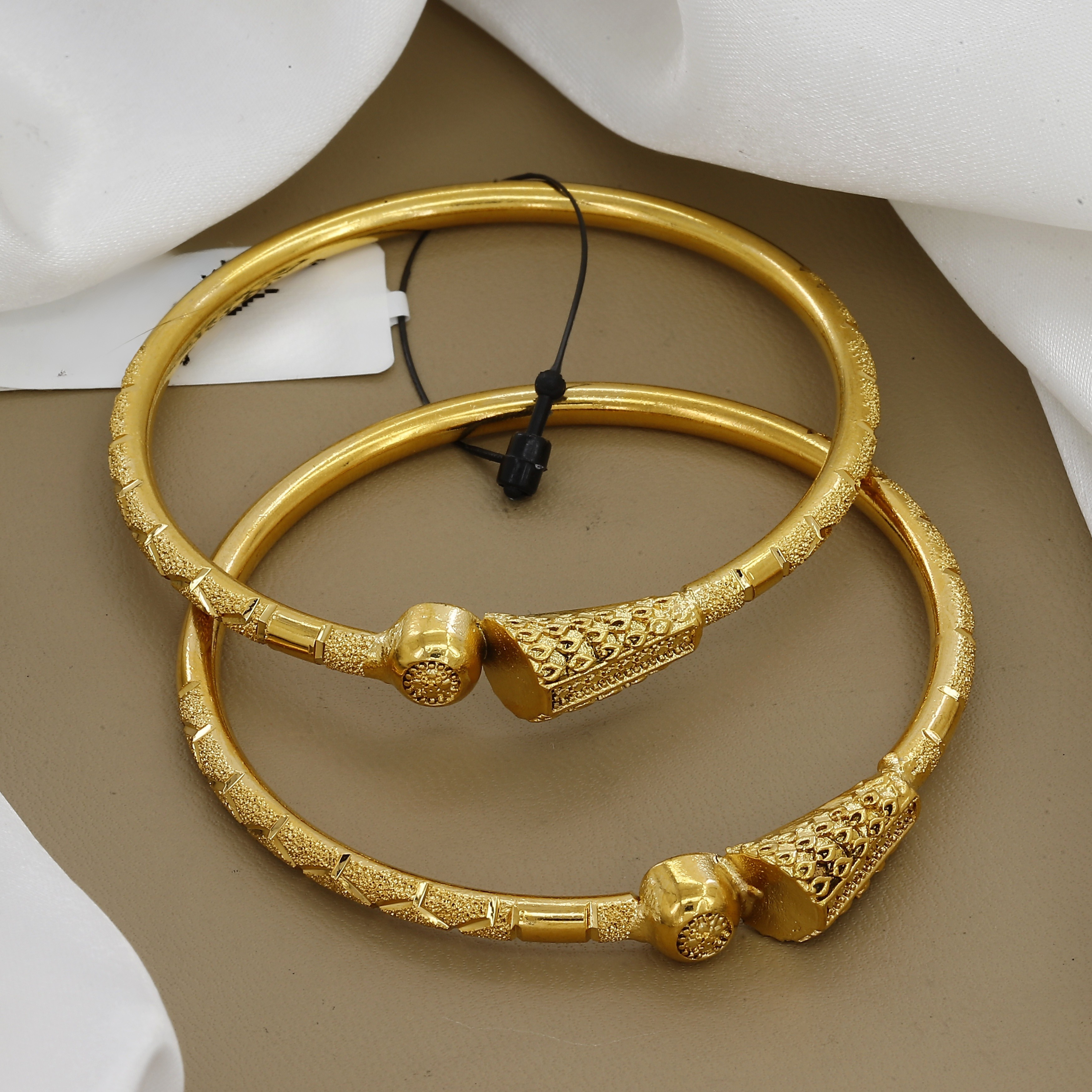 Western Wear Gold Tone Set Of 2 Bangles with Intricate Filigree Design
