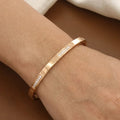Elegant Gold Hinged Bangle Bracelet with Stone Accents